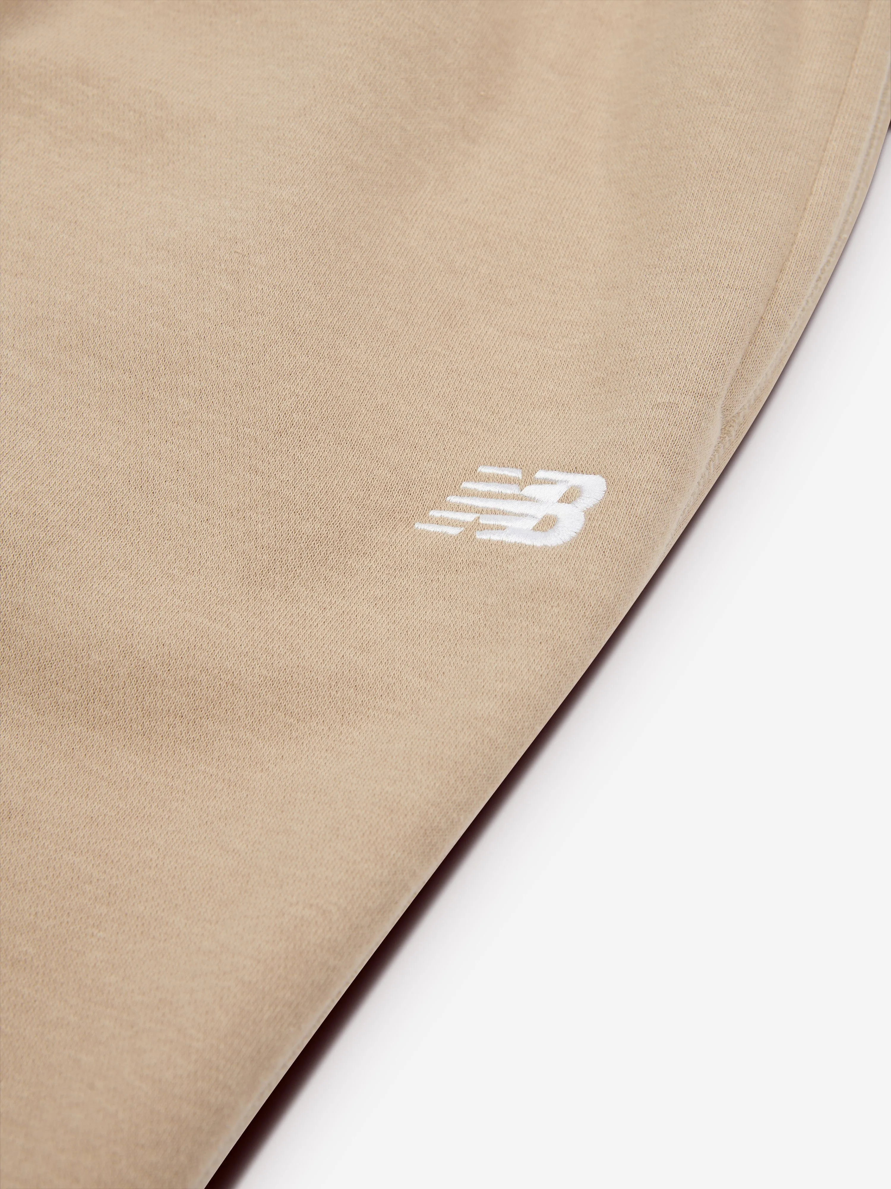 New Balance Boys Brush Back Small Logo Joggers in Beige